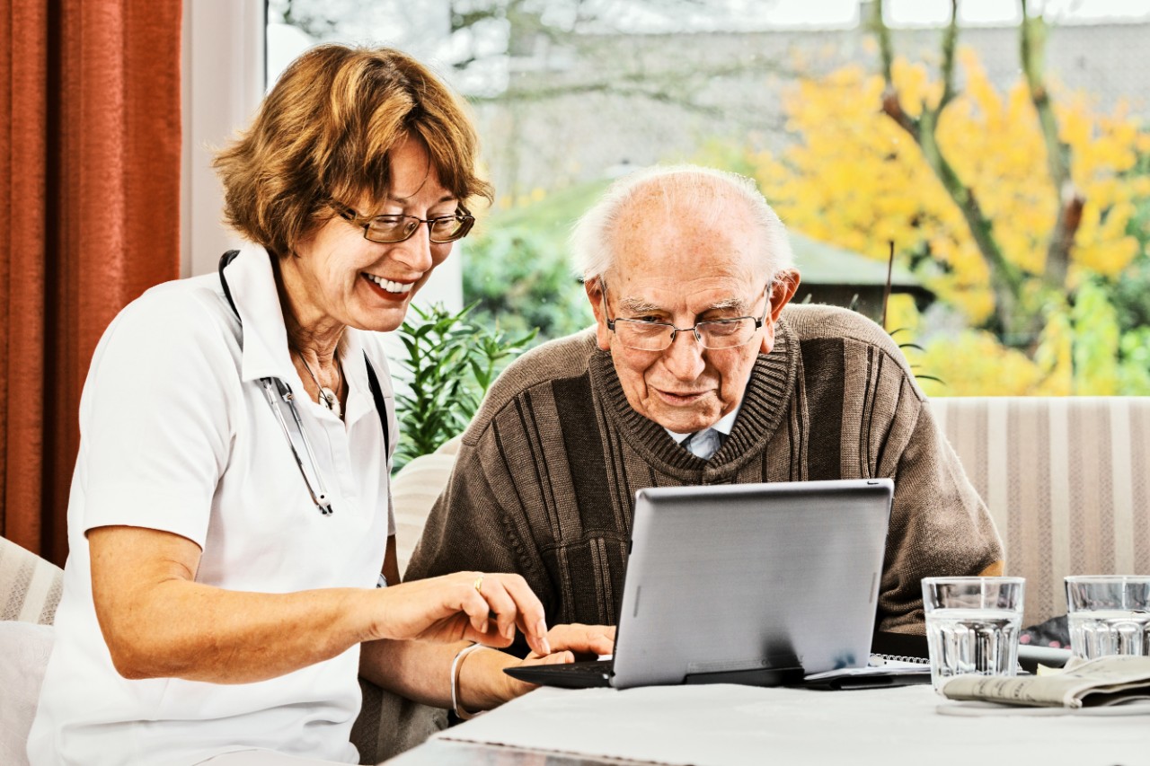 Nurse caring for elderly person