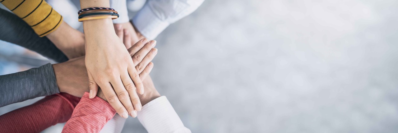 Stack of hands. Unity and teamwork concept. Stapel Hände