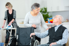 old couple talking while being assisted