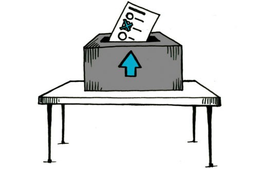 Grafik zu Landtagswahlen: Tisch darauf steht eine Urne, in der ein Wahlzettel steckt