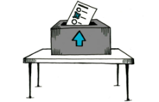 Wahljahr 2021: Ein Tisch mit Wahlurne, in der ein Wahlzettel steckt