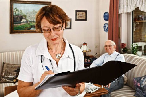 Nurse caring for elderly person